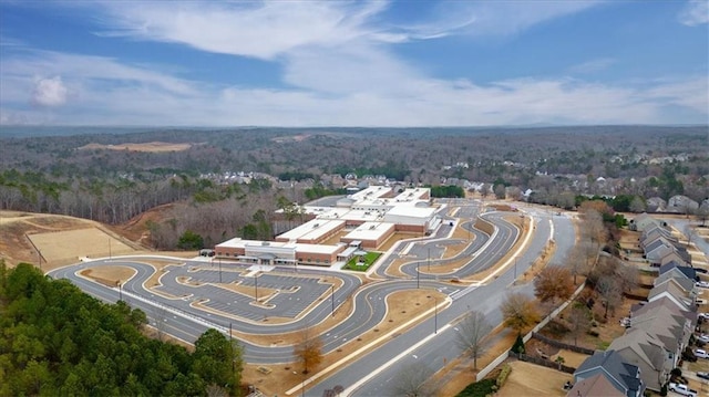 drone / aerial view featuring a view of trees