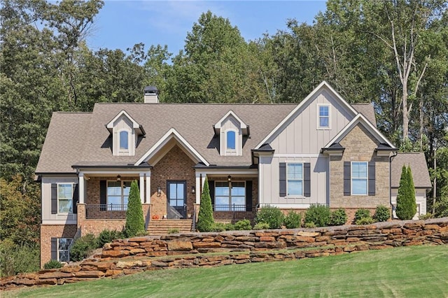 craftsman house featuring a front yard and a porch