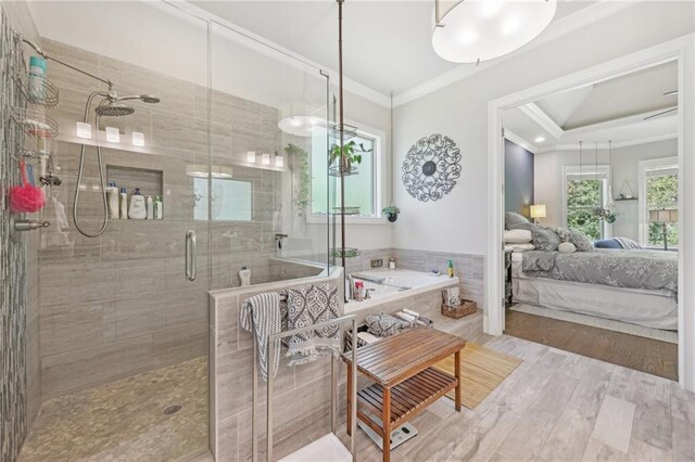 bathroom featuring walk in shower, hardwood / wood-style flooring, and crown molding