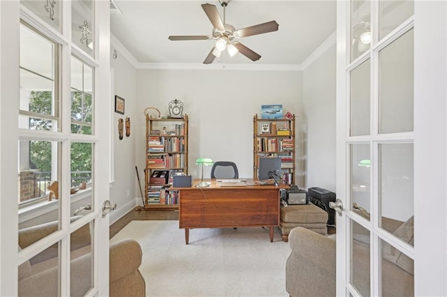 home office with hardwood / wood-style floors, ceiling fan, french doors, and crown molding