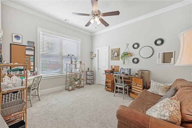 office area with ornamental molding, ceiling fan, and light colored carpet