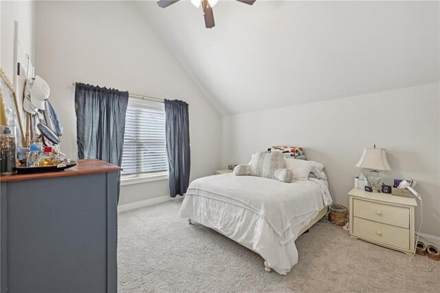 bedroom with carpet, lofted ceiling, and ceiling fan