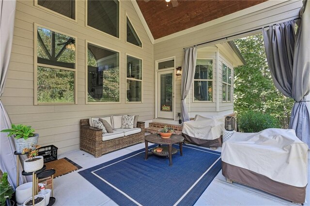 exterior space featuring wooden ceiling and lofted ceiling