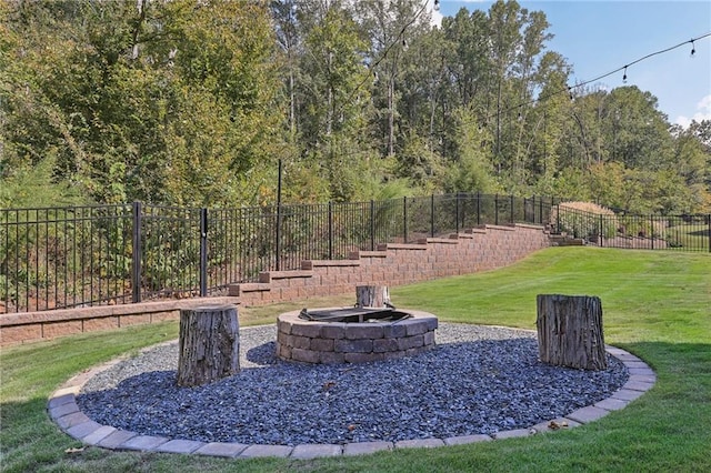 view of yard with an outdoor fire pit