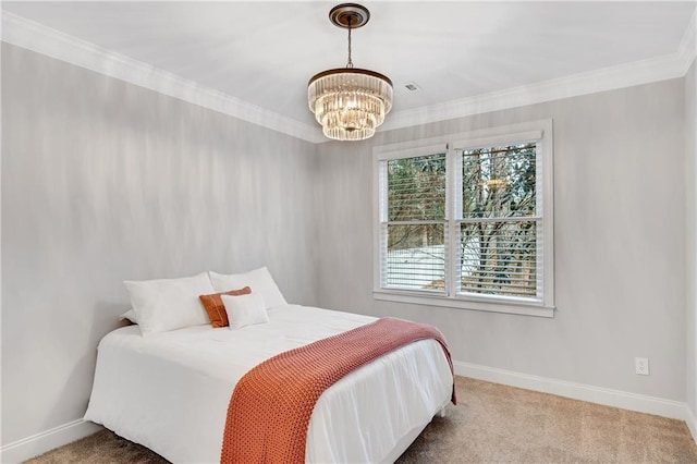 bedroom featuring an inviting chandelier, crown molding, and carpet floors