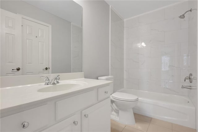 full bathroom featuring tile patterned flooring, vanity, tiled shower / bath combo, and toilet