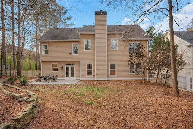 rear view of house featuring a patio and french doors