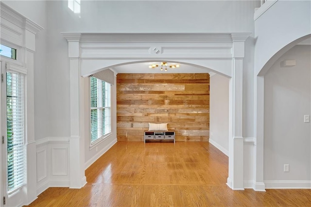 unfurnished living room with a wealth of natural light and light hardwood / wood-style floors