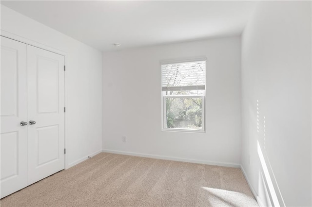 1119 Lockhart Way, Douglasville, GA 30135 - unfurnished bedroom featuring light carpet and a closet