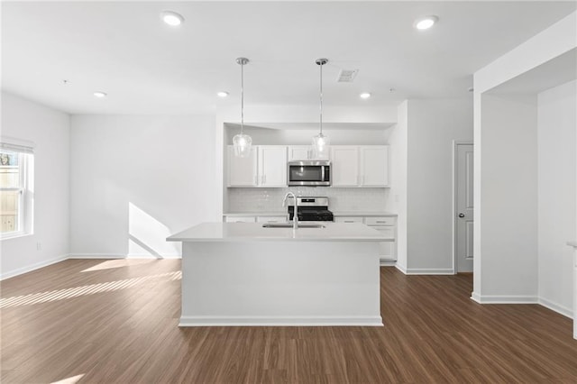 1119 Lockhart Way, Douglasville, GA 30135 - kitchen with appliances with stainless steel finishes, light countertops, tasteful backsplash, white cabinetry, and dark wood-style floors