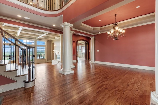 2742 High Vista Pt, Gainesville, GA 30501 - unfurnished living room with ornate columns, recessed lighting, wood finished floors, coffered ceiling, and ornamental molding