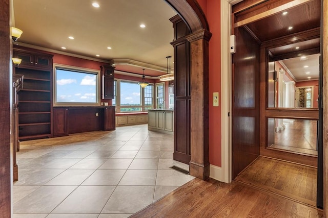 2742 High Vista Pt, Gainesville, GA 30501 - corridor with ornamental molding, arched walkways, recessed lighting, baseboards, and light tile patterned floors