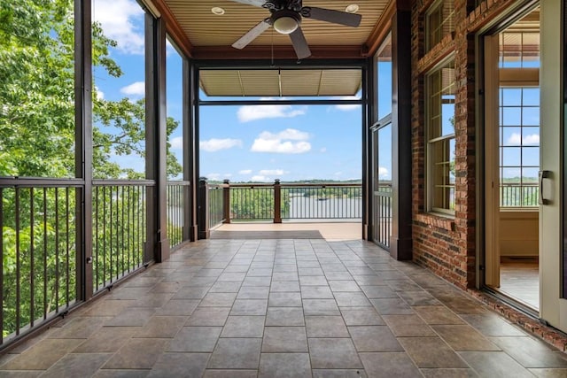 2742 High Vista Pt, Gainesville, GA 30501 - unfurnished sunroom featuring a ceiling fan and a water view