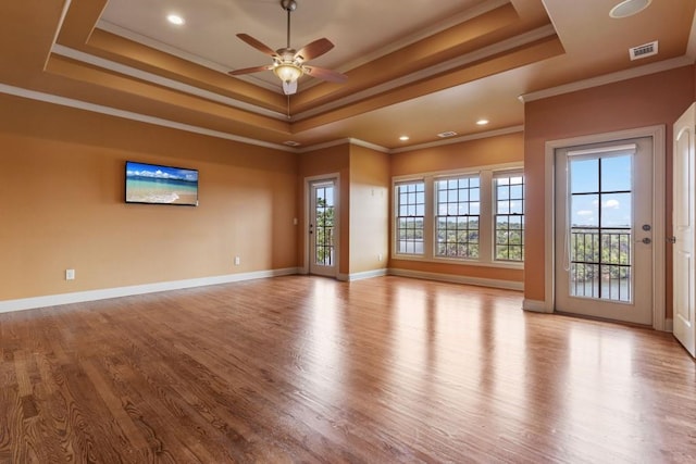 2742 High Vista Pt, Gainesville, GA 30501 - spare room with a raised ceiling, wood finished floors, ceiling fan, ornamental molding, and baseboards