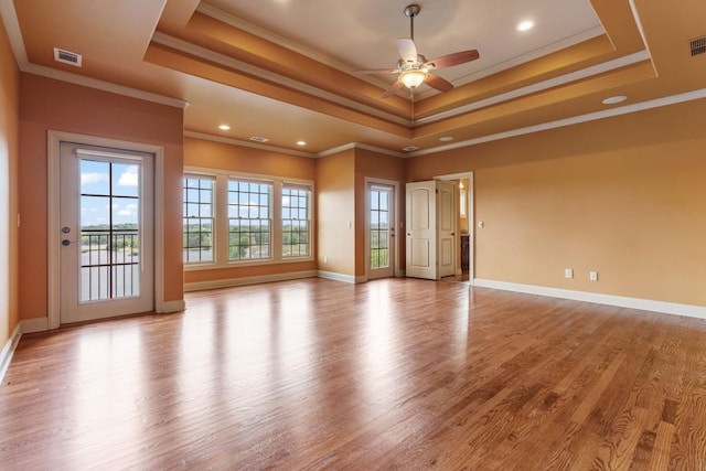 2742 High Vista Pt, Gainesville, GA 30501 - spare room featuring a raised ceiling, a ceiling fan, wood finished floors, baseboards, and ornamental molding