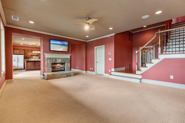 2742 High Vista Pt, Gainesville, GA 30501 - unfurnished living room with ceiling fan, carpet flooring, baseboards, stairs, and ornamental molding