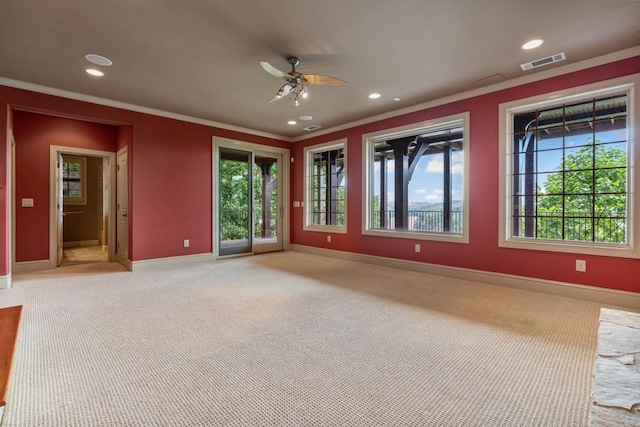2742 High Vista Pt, Gainesville, GA 30501 - spare room featuring crown molding, baseboards, a ceiling fan, plenty of natural light, and light carpet