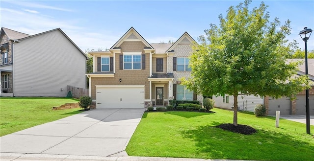 view of front of property featuring a garage and a front lawn