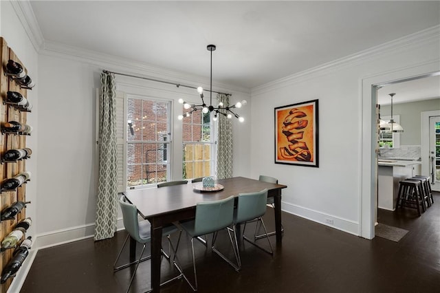 311 Glendale Ave, Decatur, GA 30030 - dining area featuring crown molding, a chandelier, dark wood-type flooring, and healthy amount of natural light
