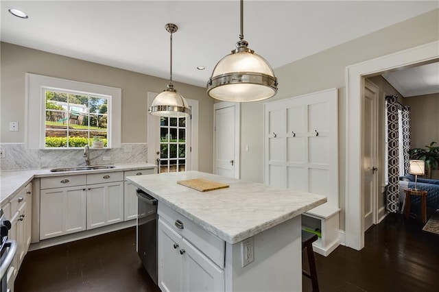 311 Glendale Ave, Decatur, GA 30030 - kitchen featuring dark wood finished floors, backsplash, a kitchen island, recessed lighting, and white cabinetry
