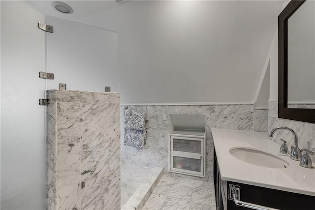 311 Glendale Ave, Decatur, GA 30030 - bathroom featuring vanity, a wainscoted wall, marble finish flooring, and tile walls