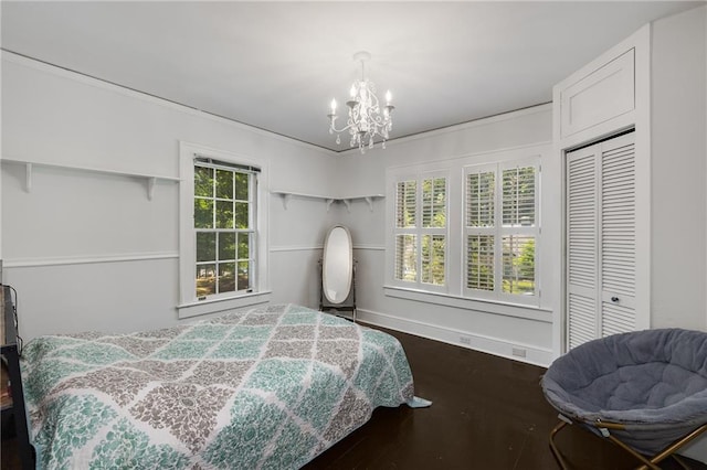 311 Glendale Ave, Decatur, GA 30030 - bedroom featuring a chandelier, dark wood finished floors, and a closet