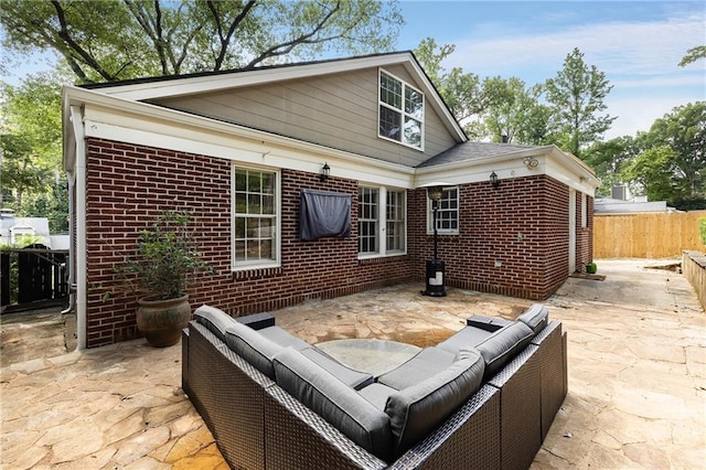 311 Glendale Ave, Decatur, GA 30030 - rear view of house with an outdoor living space, brick siding, and a patio
