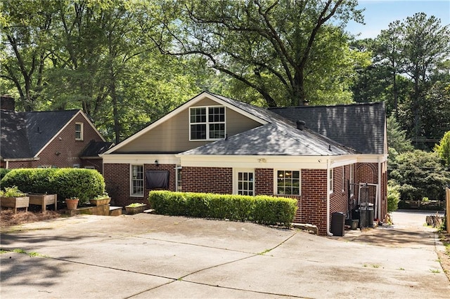 311 Glendale Ave, Decatur, GA 30030 - view of front of home with brick siding, roof with shingles, and concrete driveway