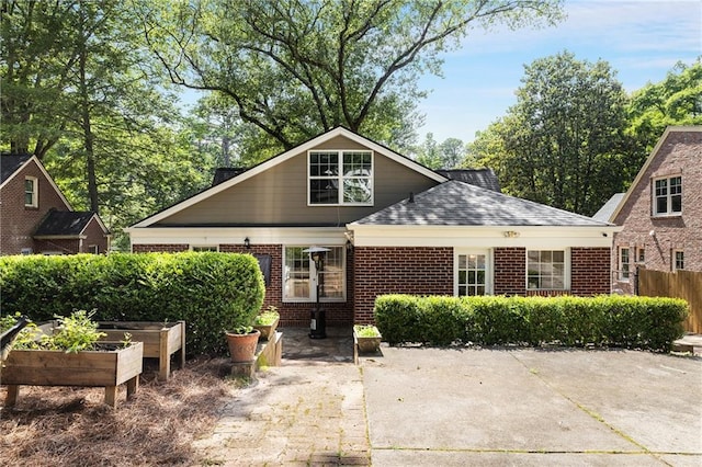 311 Glendale Ave, Decatur, GA 30030 - view of front facade with a garden and brick siding