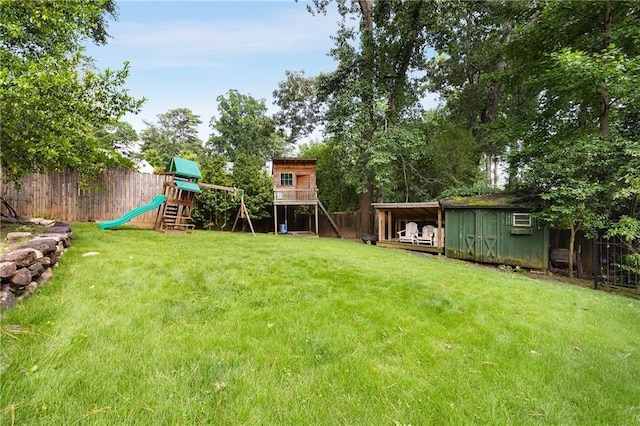 311 Glendale Ave, Decatur, GA 30030 - fenced backyard featuring a playground and a storage unit