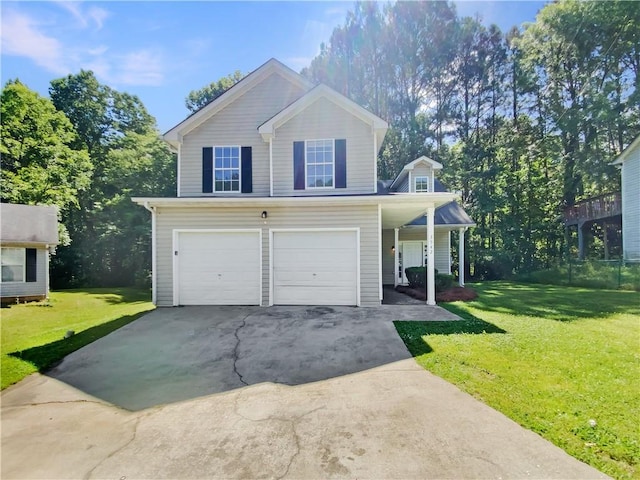 view of property featuring a front lawn and a garage