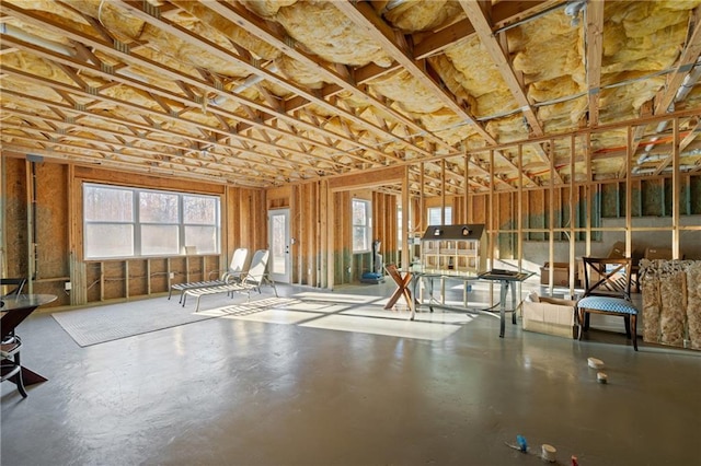 miscellaneous room featuring plenty of natural light and finished concrete flooring