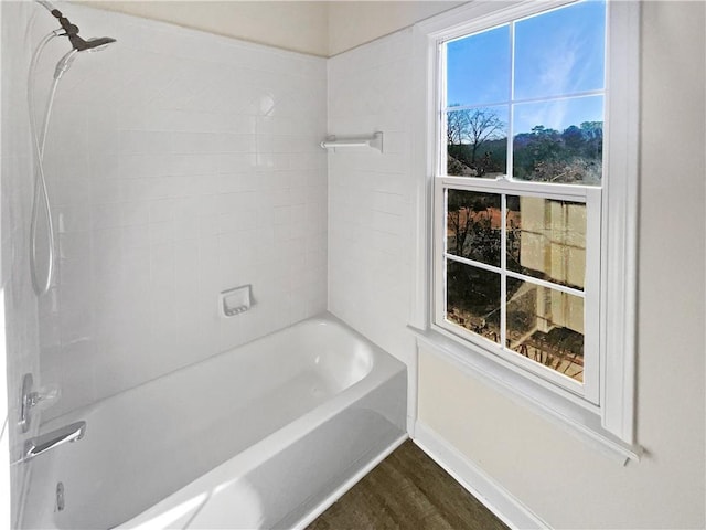 3905 Colonial Trl SW, Lilburn, GA 30047 - bathroom with wood finished floors, shower / washtub combination, and baseboards