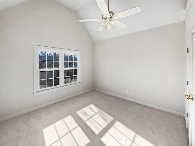 carpeted empty room featuring lofted ceiling and ceiling fan