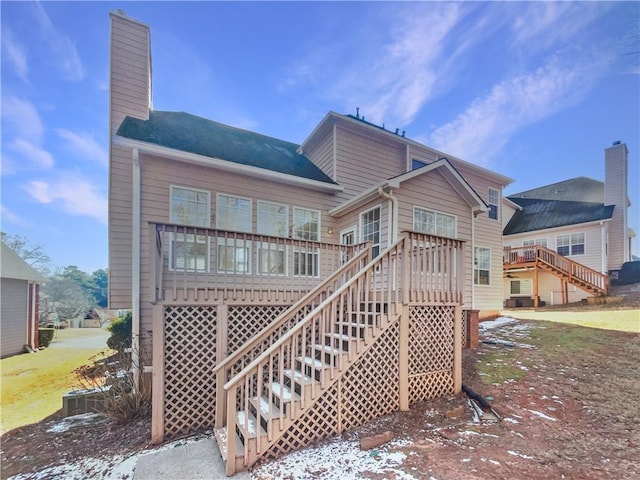 3905 Colonial Trl SW, Lilburn, GA 30047 - rear view of property with stairway, a deck, and a chimney