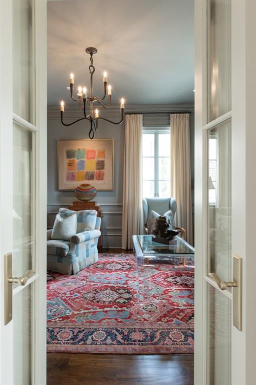 interior space featuring dark wood-style flooring and a chandelier