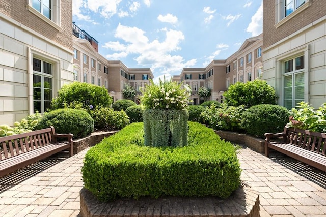 view of home's community with a residential view and a patio