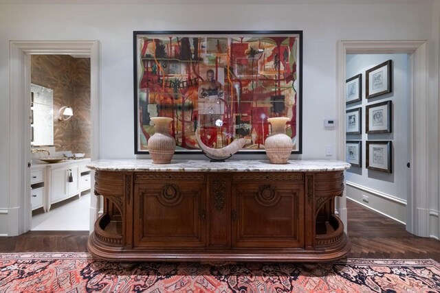 interior details featuring wood finished floors and a sink