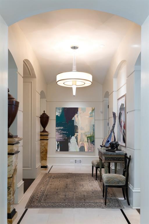 hallway with lofted ceiling