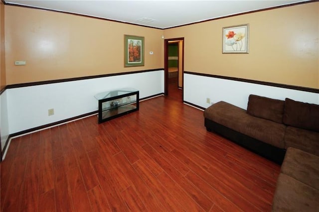 unfurnished living room with dark hardwood / wood-style flooring and crown molding