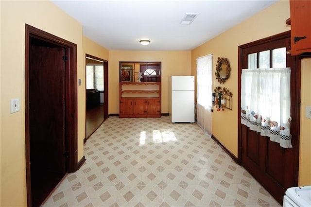 kitchen featuring white fridge