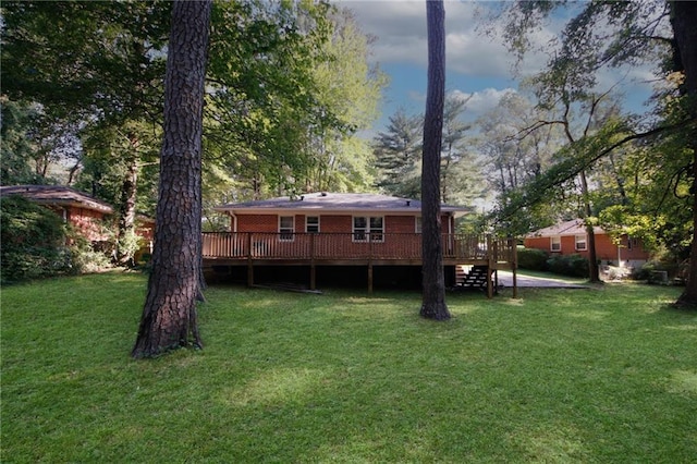 view of yard with a wooden deck