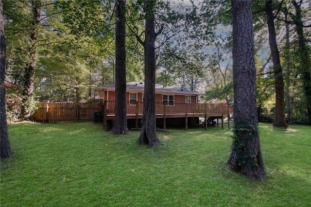 view of yard with a wooden deck