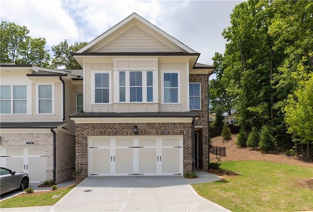 view of front of home featuring a garage and a front yard