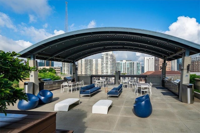943 Peachtree St NE Unit 1518, Atlanta, GA 30309 - view of property's community with outdoor dining area, a view of city, and a patio area