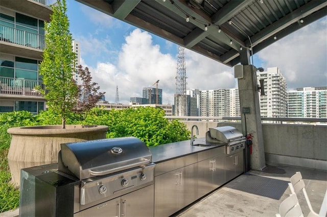 943 Peachtree St NE Unit 1518, Atlanta, GA 30309 - view of patio with a view of city and a sink