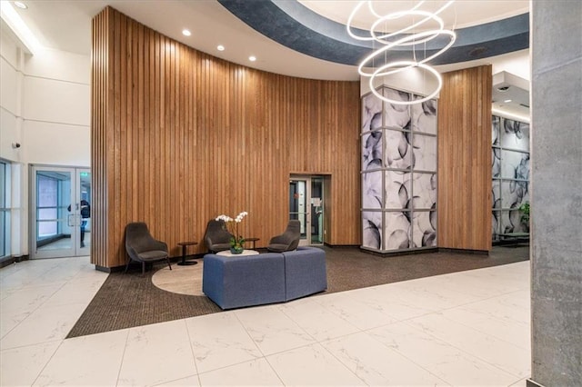 943 Peachtree St NE Unit 1518, Atlanta, GA 30309 - lobby featuring a towering ceiling, wood walls, and recessed lighting
