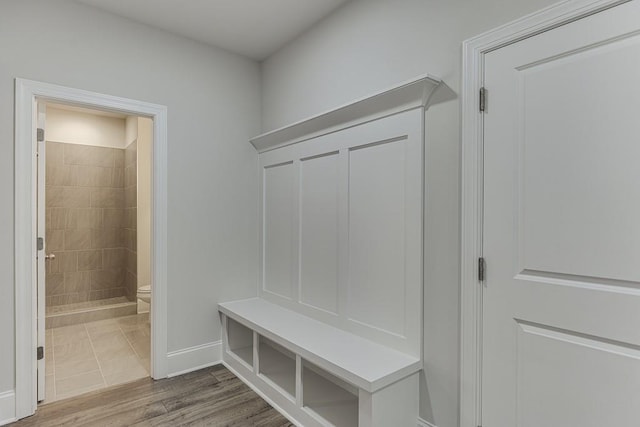 mudroom featuring wood finished floors and baseboards