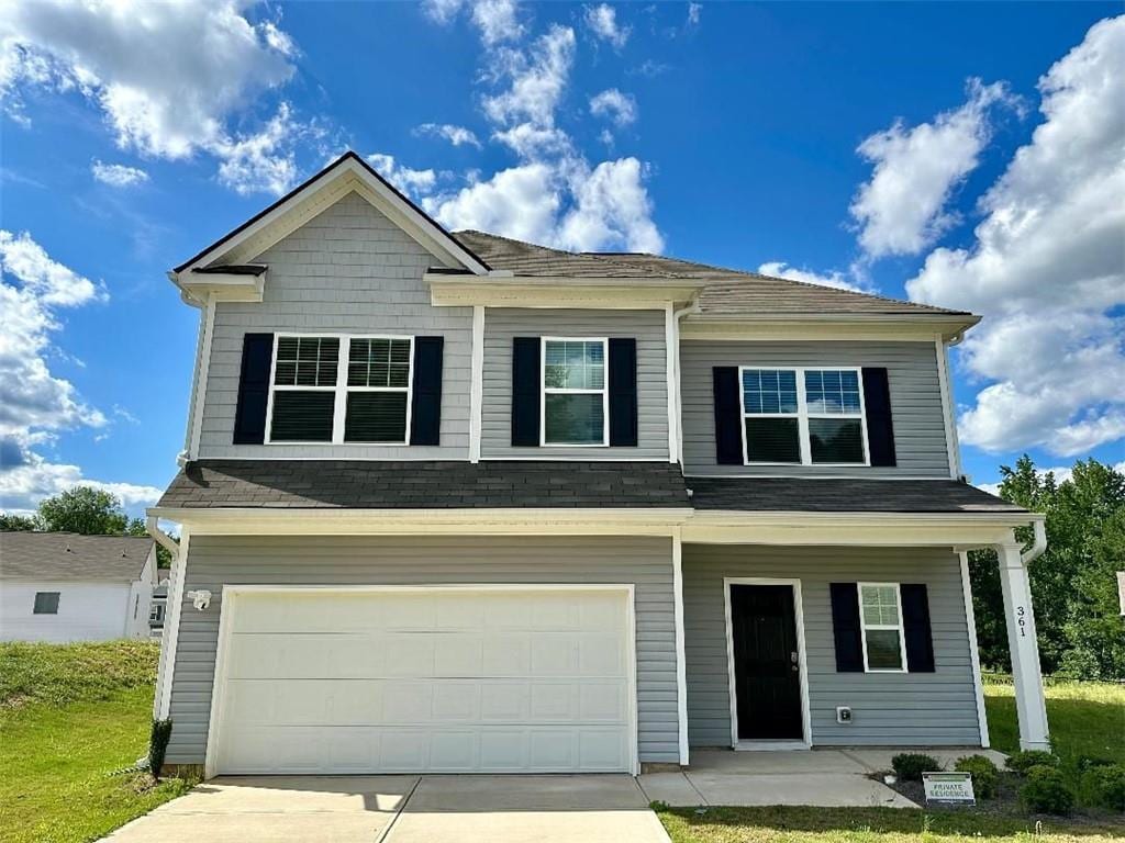 view of front of property with a garage