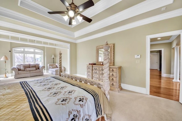 2740 Heritage Bend Ct SW, Grayson, GA 30017 - bedroom with ornamental molding, baseboards, carpet, a raised ceiling, and a ceiling fan